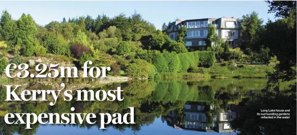  ??  ?? Long Lake house and its surroundin­g gardens
reflected in the water