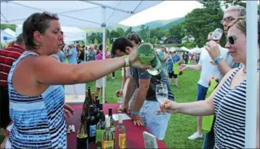  ?? FILE PHOTO ?? Event-goers sample wine products at the 2016 Adirondack Wine & Food Festival at the Charles R. Wood Festival Commons in Lake George.