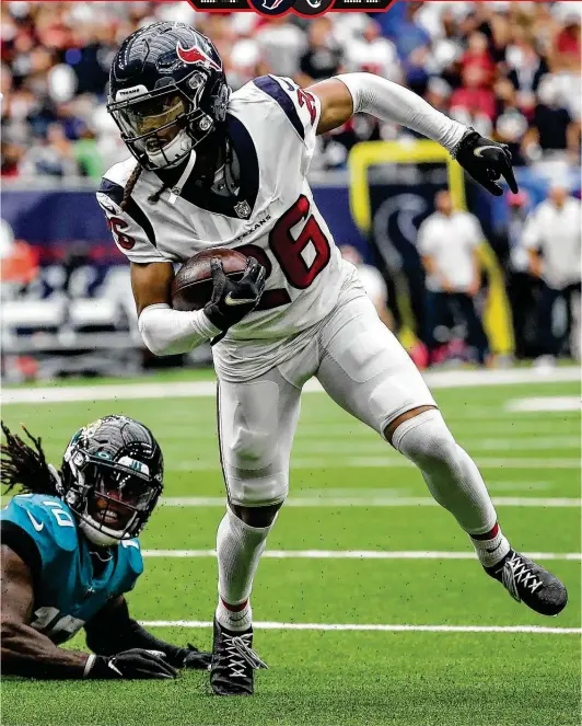  ?? Brett Coomer / Staff photograph­er ?? Texans cornerback Vernon Hargreaves III runs past Jaguars receiver Laviska Shenault Jr. with an intercepti­on of a Trevor Lawrence pass in the second quarter.