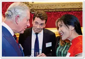  ??  ?? ROYAL CONNECTION­S: Li Xuelin with Prince Charles in 2017