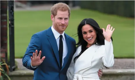  ?? AP PHOTO ?? Prince Harry and American actor Meghan Markle pose for the media in the grounds of Kensington Palace in London on Monday. The couple will be married in the spring, royal officials announced on Monday.