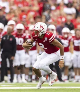  ?? Rebecca S. Gratz, The Associated Press ?? Nebraska’s Adrian Martinez carries the ball against Fordham during the first half on Saturday.