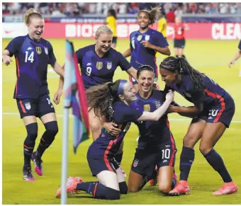  ?? Michael Wyke / Associated Press ?? U.S. forward Carli Lloyd (10) celebrates after scoring 23 seconds into a tuneup game against Jamaica. Lloyd, about to turn 39, will be the oldestever U.S. women’s soccer Olympian.