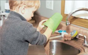  ?? PICTURE: WASHINGTON POST ?? Making time to teach children a variety of life skills and how to do chores, such as washing the dishes, will serve them well later in life.