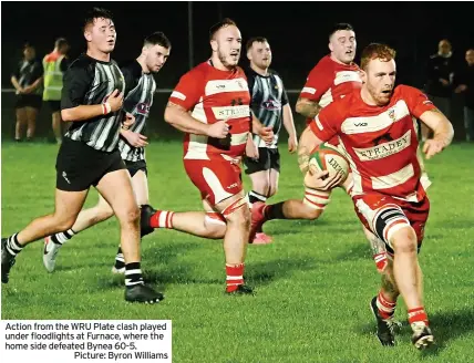  ?? Picture: Byron Williams ?? Action from the WRU Plate clash played under floodlight­s at Furnace, where the home side defeated Bynea 60-5.