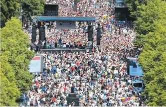  ?? AP-Yonhap ?? People gather for a demonstrat­ion with the slogan “The end of the pandemic — freedom day” against coronaviru­s restrictio­ns in Berlin, Saturday.