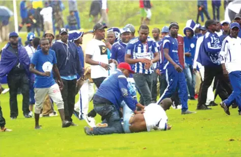  ??  ?? A ball boy is manhandled by a Dembare fan at Ngezi Platinum