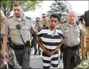  ?? CHARLIE NEIBERGALL / AP ?? Cristhian Bahena Rivera, 24, charged with first-degree murder in the death of Mollie Tibbetts, is escorted Wednesday.