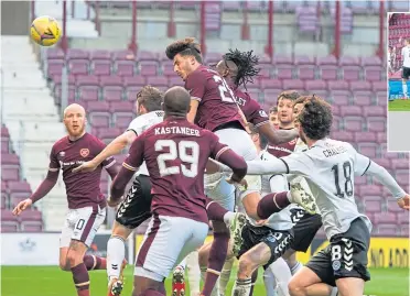  ??  ?? Armand Gnanduille­t wins the Ayr play to secure the opener for Hearts