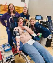  ?? Photo submitted ?? Community Blood Bank staffers Jaylin Mead (top left) and Nina Miller (top right) with donors Keigan Smith (seated) and Arianna Greville (bottom right) from Kane High School blood drive on March 20 that had 17 donors.