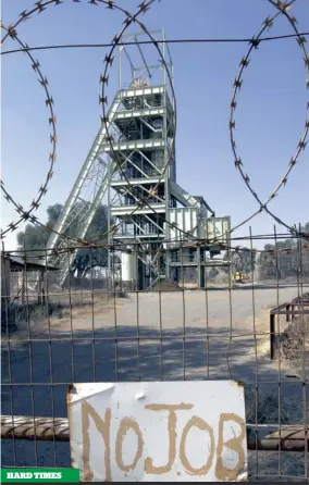  ?? PICTURE: REUTERS ?? HARD TIMES A sign in front of a disused mine shaft at the Aurora gold mine east of Joburg