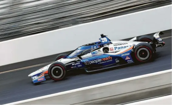 ?? Andy Lyons / Getty Images ?? Takuma Sato, who drives for Rahal Letterman Lanigan Racing, won his second Indianapol­is 500 at a crowdless Indianapol­is Motor Speedway on Sunday.