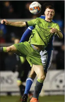  ??  ?? Mark Doyle wins this aerial duel against Jacob Borg of Finn Harps.