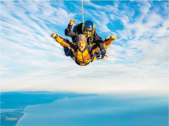  ?? Photo / Supplied ?? Richie McCaw completes his first skydive over Mt Maunganui to mark his and wife Gemma's new roles.