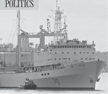  ?? ANDREW VAUGHAN / THE CANADIAN PRESS ?? HMCS Preserver, one of Canada’s operationa­l support ships, designed to carry large amounts of fuel, provisions, and dry stores during naval operations, is pushed by tugs in Halifax harbour in October 2011. Its name, and that of HMCS Protecteur, will...
