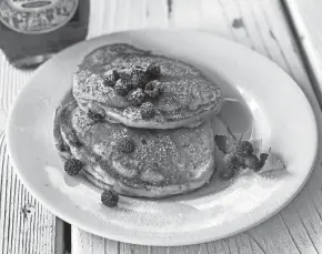  ?? JENNIFER RUDE KLETT ?? Berry lovers should try black raspberrie­s in pancakes with pure Wisconsin maple syrup.
