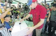  ?? [AP PHOTO] ?? Opposition leader Henrique Capriles casts his ballot during a symbolic referendum Sunday in Caracas, Venezuela.