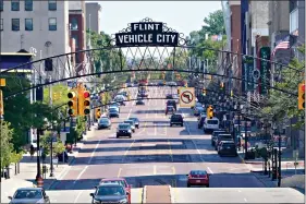  ?? (AP Photo/Carlos Osorio) ?? Saginaw Avenue is seen Thursday in downtown Flint, Mich. Michigan Gov. Gretchen Whitmer says a proposed $600 million deal between the state of Michigan and Flint residents harmed by lead-tainted water is a step toward making amends. Officials announced the settlement Thursday, which must be approved by a federal judge.