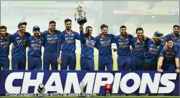  ?? Indian players pose with the Series Trophy ??