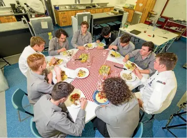  ?? PHOTOS: SIMON O’CONNOR/STUFF ?? Kai with Soul at New Plymouth Boys’ High School.The theme for today was Italian, including sitting around a table and enjoying a meal as a big family.