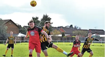  ?? Picture: Peter Langley ?? Action from last Saturday’s Gloucester­shire County League game between Gala Wilton and visitors Shirehampt­on (red shirts). Shirehampt­on, the leaders, won 2-0