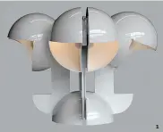  ??  ?? 1. LA LAMPE RUSPA, véritable sculpture lumineuse, créée en 1967-68.
2. LE FAUTEUIL LOCUS SOLUS, à structure tubulaire, réédition d’un modèle de 1964 (Exteta). 1