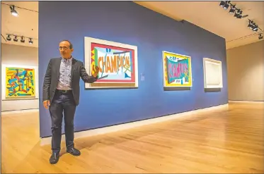  ?? NWA Democrat-Gazette/SPENCER TIREY ?? Harry Cooper, curator at the National Gallery of Art, talks Thursday to the media during an early tour at Crystal Bridges Museum of American Art of its upcoming exhibition by artist Stuart Davis titled “In Full Swing” at the Bentonvill­e museum. The...