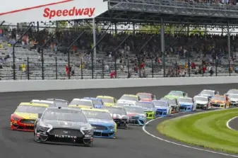  ?? Associated Press photos ?? Indianapol­is Motor Speedway, site of one of the most storied races in the world, the Indianapol­is 500, left, and NASCAR’s Brickyard 400, right, will mark a first this weekend when it plays host to both series.