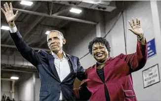  ?? ALYSSA POINTER / ALYSSA.POINTER@AJC.COM ?? Former President Barack Obama and Georgia gubernator­ial candidate Stacey Abrams wave to the crowd following a rally in Forbes Arena at Morehouse College on Friday.