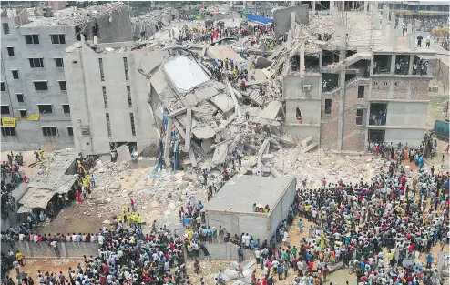  ?? MUNIR UZ ZAMAN / AFP / GETTY IMAGES FILES ?? Volunteers and rescue workers in 2013 after an eight-storey garment factory collapsed in Bangladesh. An Ontario judge has dismissed a class-action suit against Loblaw, whose brand Joe Fresh was a factory customer.