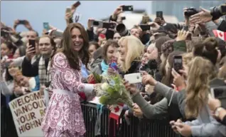  ?? JONATHAN HAYWARD, THE CANADIAN PRESS ?? The Duchess of Cambridge greets well-wishers on her arrival in Vancouver on Sunday.