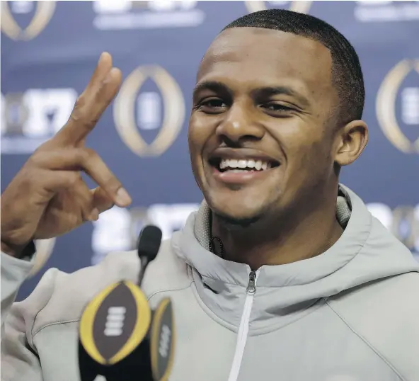  ?? — THE ASSOCIATED PRESS ?? Clemson quarterbac­k Deshaun Watson, who topped 1,000 yards rushing and 4,000 yards passing, answers questions during media day Saturday for Monday’s College Football Playoff championsh­ip game against Alabama in Tampa.