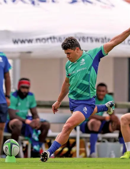  ?? Photo: Fijian Drua ?? Swire Shipping Fijian Drua first five eight Caleb Muntz kicks for goal during training at Lennox Head, NSW, Australia.