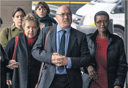  ??  ?? Mr Goldring arrives to appear before MPS, with Caroline Thomson, Oxfam’s chairman, left, and Winnie Byanyima, Oxfam’s internatio­nal executive director