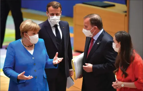  ?? FOTO: JOHN THYS/LEHTIKUVA-AFP ?? Tysklands förbundska­nsler Angela Merkel, Frankrikes president Emmanuel Macron, Sveriges statsminis­ter Stefan Löfven och statsminis­ter Sanna Marin under andra dagen av EU:s toppmöte.