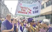  ?? PICTURE: PA WIRE ?? To mark 100 years since women got the vote in England, a group of friends join the march through London dressed in green, purple and white – the colours of the suffragett­e movement – to help their children understand “what happened 100 years ago and...