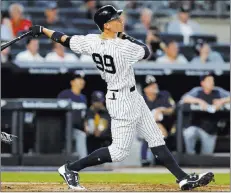  ?? Kathy Willens ?? The Associated Press New York Yankees slugger Aaron Judge has led hitters on a record home-run pace; MLB is poised to record 6,127 HRS this year, nearly 500 more than its best season in 2000.