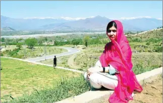 ?? ABDUL MAJEED/AFP ?? Pakistani activist and Nobel Peace Prize laureate Malala Yousafzai near Mingora in March last year.
