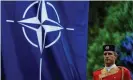  ?? Photograph: Stevo Vasiljevic/ Reuters ?? A Montenegri­n guard of honor stands next to a Nato flag during a 2017 ceremony to mark the accession to Nato of Montenegro in Podgorica.