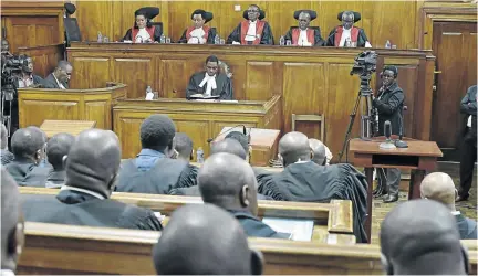  ?? / SIMON MAINA/ AFP PHOTO ?? Kenya's Supreme Court judges in Nairobi before delivering a detailed ruling laying out their reasons for annulling the August 8 presidenti­al election.