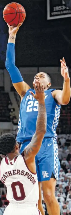  ?? AP PHOTO/ROGELIO V. SOLIS ?? Kentucky forward P.J. Washington shoots over Mississipp­i State guard Nick Weatherspo­on during the second half Saturday in Starkville, Miss. Kentucky won 71-67.