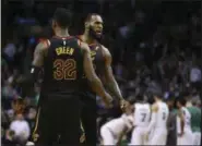  ?? ELISE AMENDOLA —ASSOCIATED PRESS ?? LeBron James and Jeff Green celebrate a play during the second half in Game 7 of the Eastern Conference finals against the Celtics on May 27.