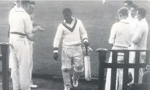  ??  ?? ●● Sir Everton leaving the pitch after another innings for Bacup