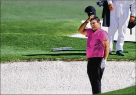  ??  ?? Patrick Reed prepares to hit from the fairway bunker on eight during the final round of the Masters. Reed’s best golf of the day was still ahead of him, on the final holes, which he played in 2 under. His 71 was the highest final round by a winner...