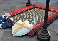  ??  ?? A symbol of national grief: the Tomb of the Unknown Soldier in Westminste­r Abbey