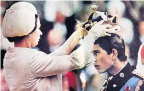  ??  ?? The real investitur­e of Prince Charles as the Prince of Wales by the Queen in 1969