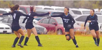  ?? ADOLPHE PIERRE-LOUIS/JOURNAL ?? Sandia Prep’s Isa Gilbert (second from right) celebrates her goal against Bosque School with teammates. Sandia Prep won 4-0 to advance to Friday’s small-school girls championsh­ip match.