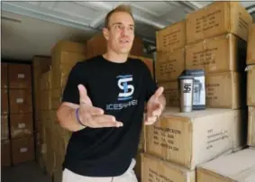  ?? TONY GUTIERREZ — THE ASSOCIATED PRESS ?? In this Thursday photo, former NFL fullback Chris Gronkowski poses with boxes of his product, as he talks about the Ice Shaker, stacked in his garage, in Colleyvill­e, Texas. For business advice, Gronkowski turned to his father, who’d had his own...