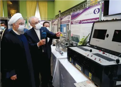  ?? (Iranian Presidency Office/WANA/Reuters) ?? IRANIAN PRESIDENT Hassan Rouhani reviews Iran’s nuclear achievemen­ts during National Nuclear Energy Day in Tehran on Saturday.