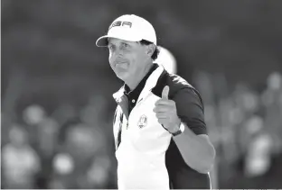  ?? AP Photo/David J. Phillip, File ?? ■ Phil Mickelson gives a thumbs-up after winning the 15th hole during a singles match Oct. 2, 2016, at the Ryder Cup golf tournament at Hazeltine National Golf Club in Chaska, Minn. Mickelson sets a record at next week's Ryder Cup with his 12th consecutiv­e appearance.